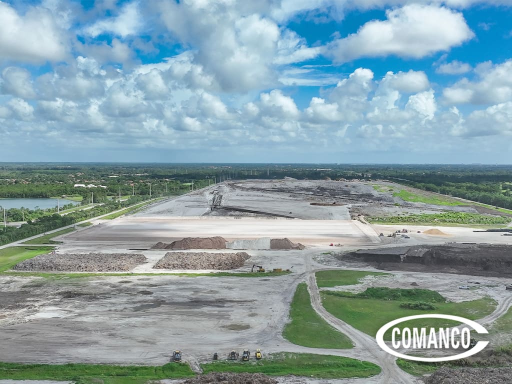Aerial overview of the SWA Palm Beach landfill showing the active mound, the expansion work area, and staged equipment
