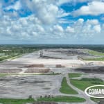 Aerial overview of the SWA Palm Beach landfill showing the active mound, the expansion work area, and staged equipment